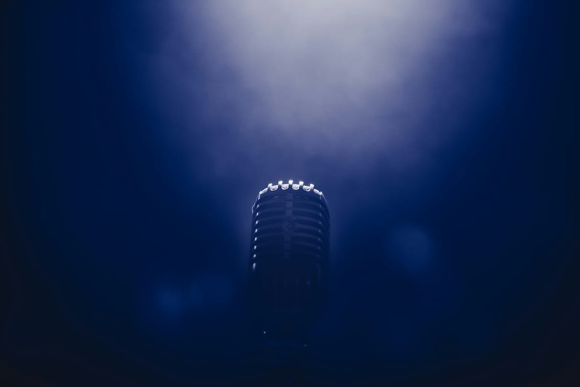 Vintage microphone under spotlight on stage