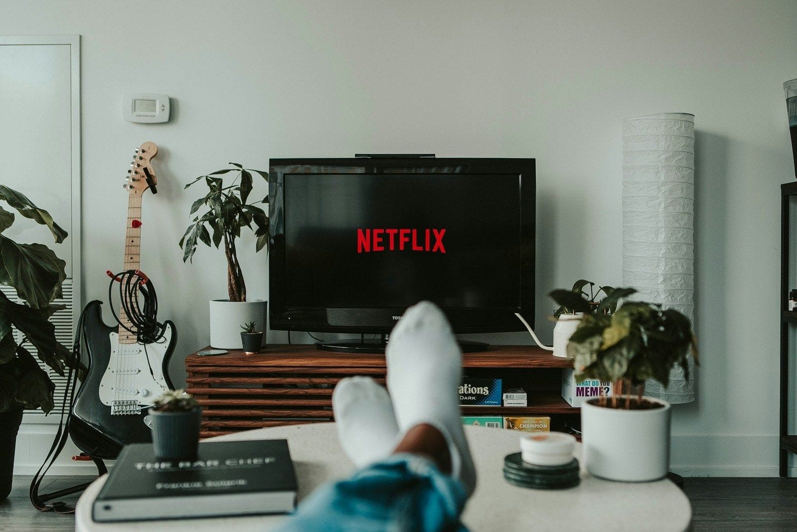 Cozy living room with Netflix on TV screen.