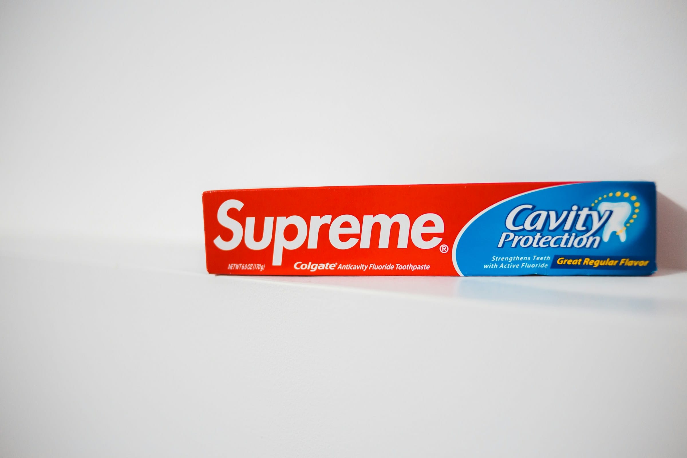 Supreme Colgate Cavity Protection toothpaste box.