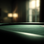 Empty poker table in a dimly lit room.