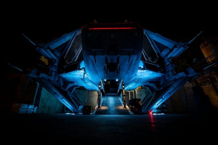 Dramatically lit futuristic spaceship at night