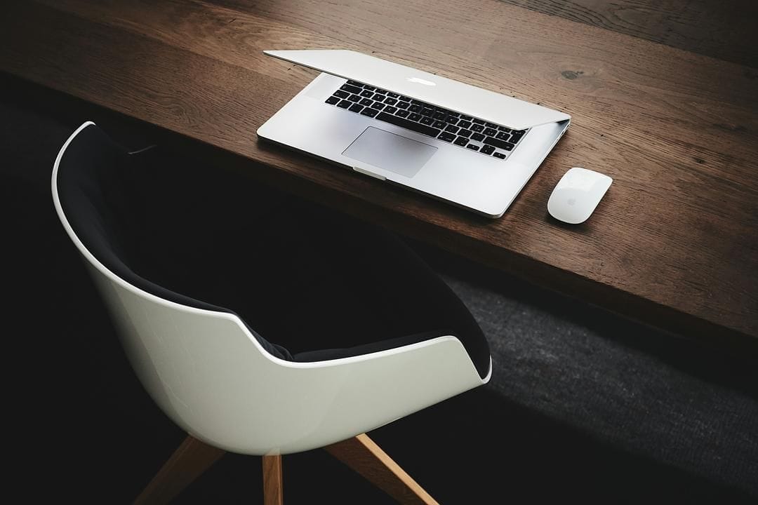 Modern desk with laptop and chair setup