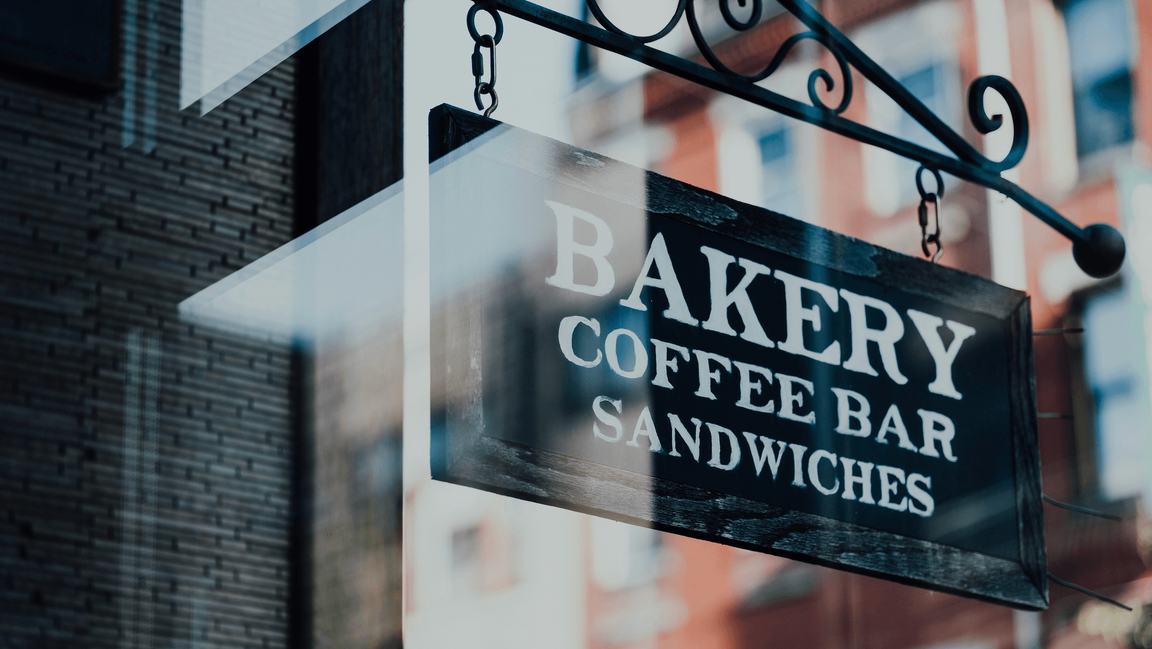 Bakery sign with coffee bar and sandwiches