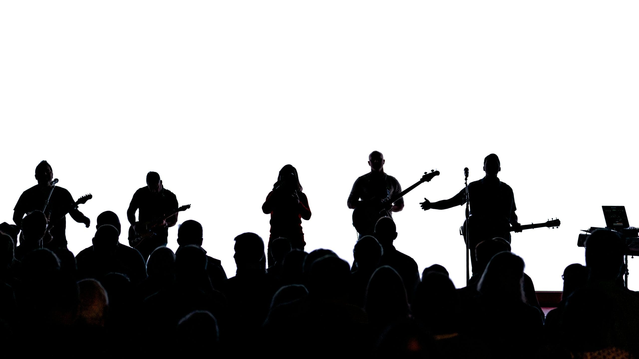 Silhouette of band performing to audience