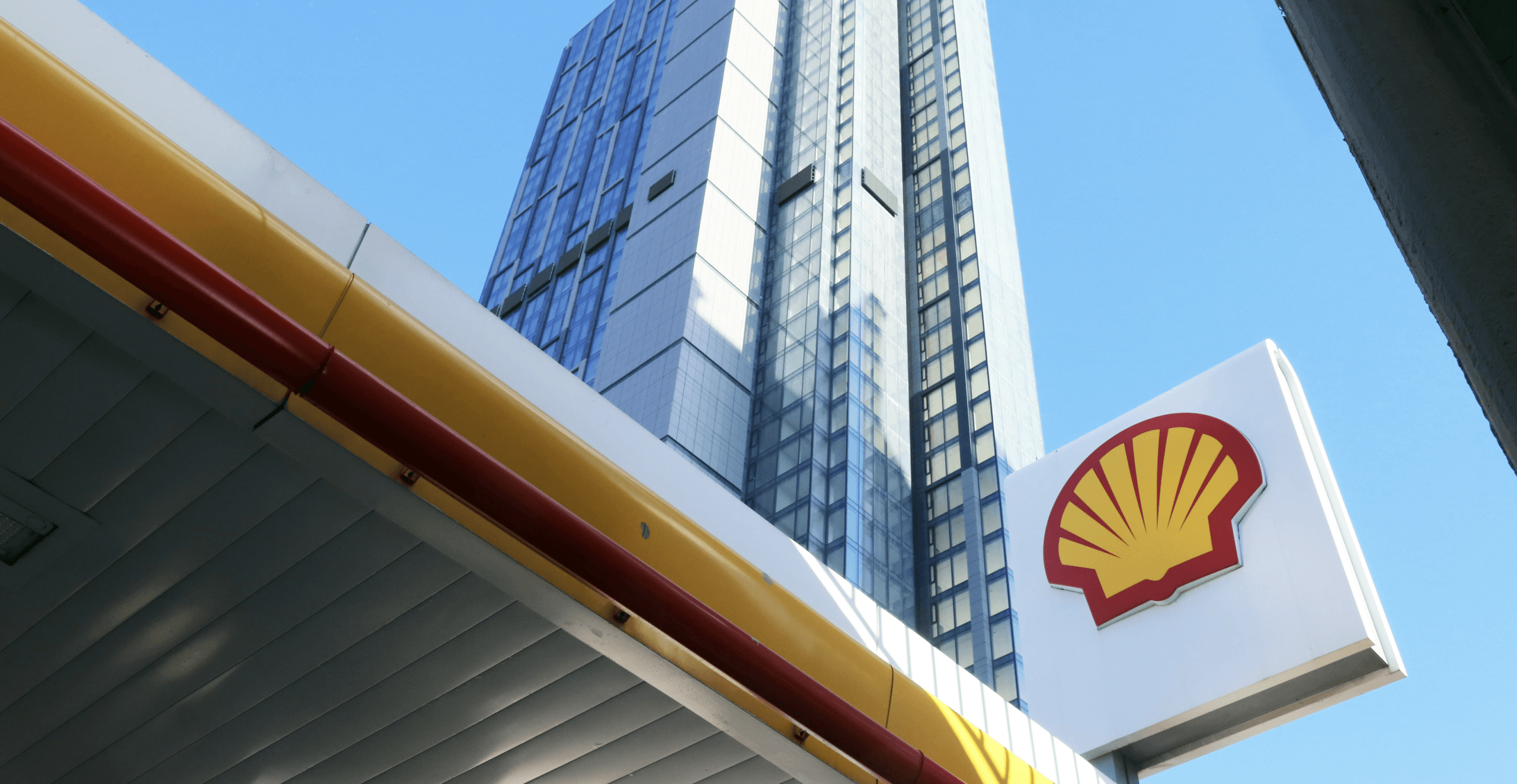 Shell gas station with skyscraper background