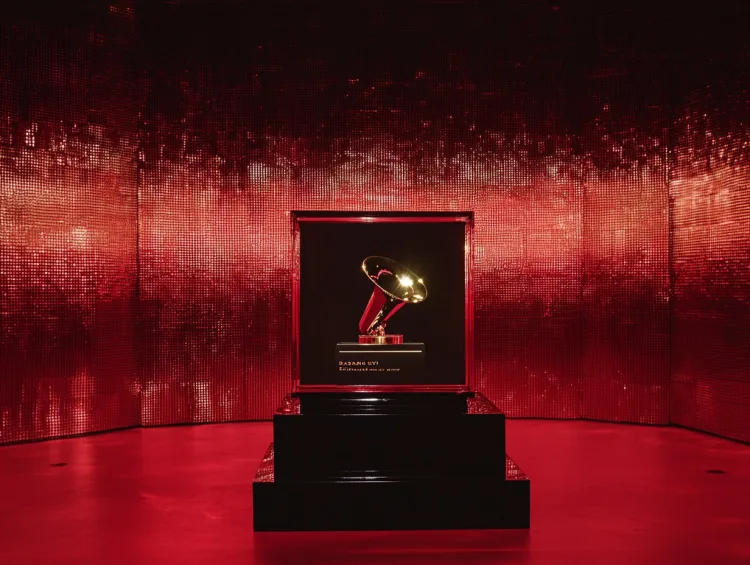 Grammy trophy displayed in red-lit room